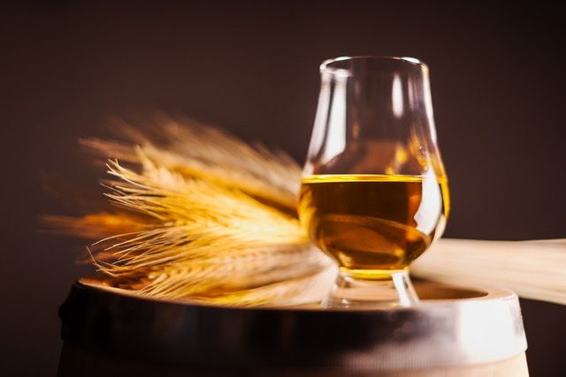 Glass of whisky with barley